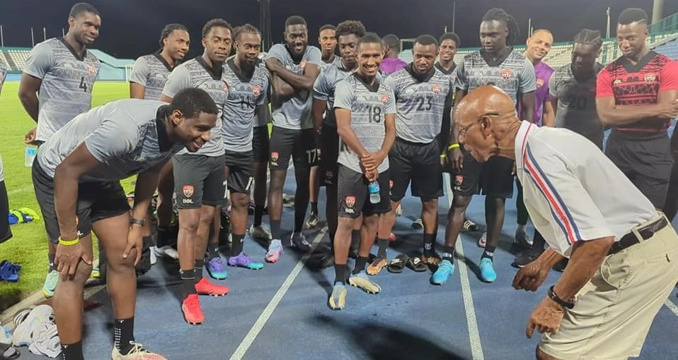 Former T&T coach Bertille St Clair raps with the T&T squad at the Dwight Yorke Stadium in Bacolet, Tobago.