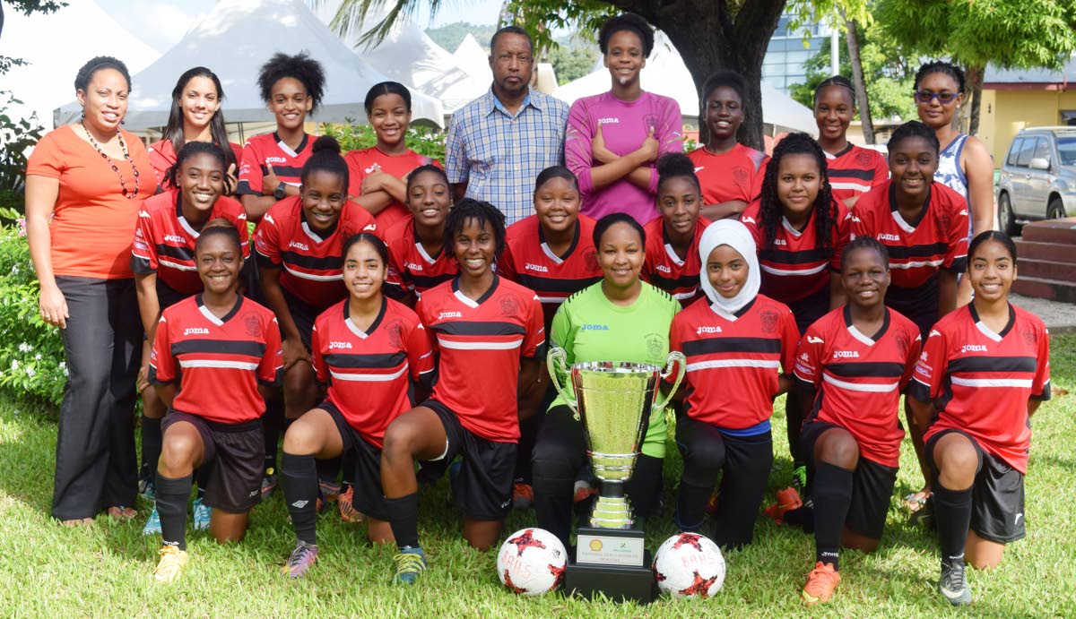 TITLE-HOLDERS: Victorious Bishop Anstey High School, Port of Spain, Girls’ football team with the Coca-Cola National Girls’ Intercol trophy