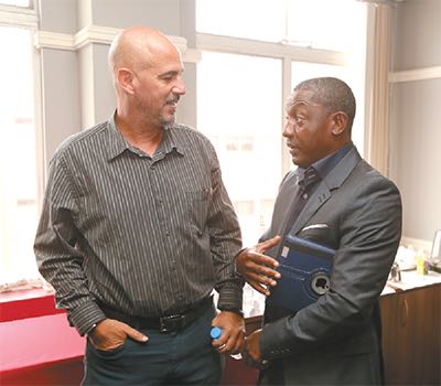 Former Soca Warriors midfielder Russell Latapy, right, and Soca Warriors head coach Stephen Hart. PHOTO: ABRAHAM DIAZ