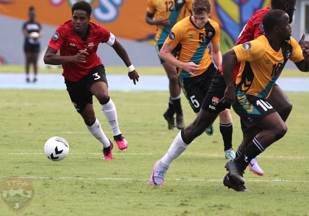 TT captain Joevin Jones runs with the ball during the Nations League League B Group C match against the Bahamas, on Friday, in Nassau. - TTFA Media