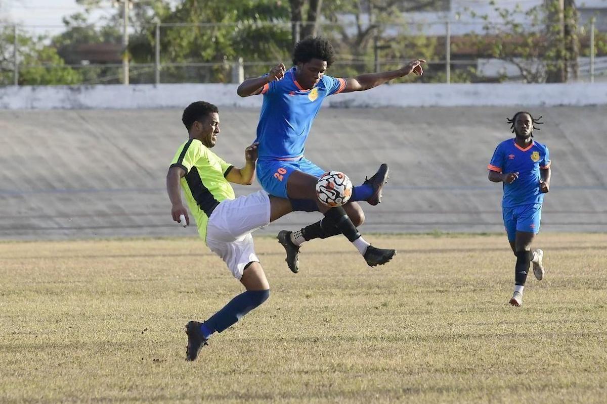 AC Port of Spain’s Jaheim McFee wins this penalty area battle against Moruga FC defender Rodney Young during this Ascension Tournament match at the Arima Velodrome in 2022. AC Port of Spain won 6-1. PHOTO BY Jermaine Cruickshank