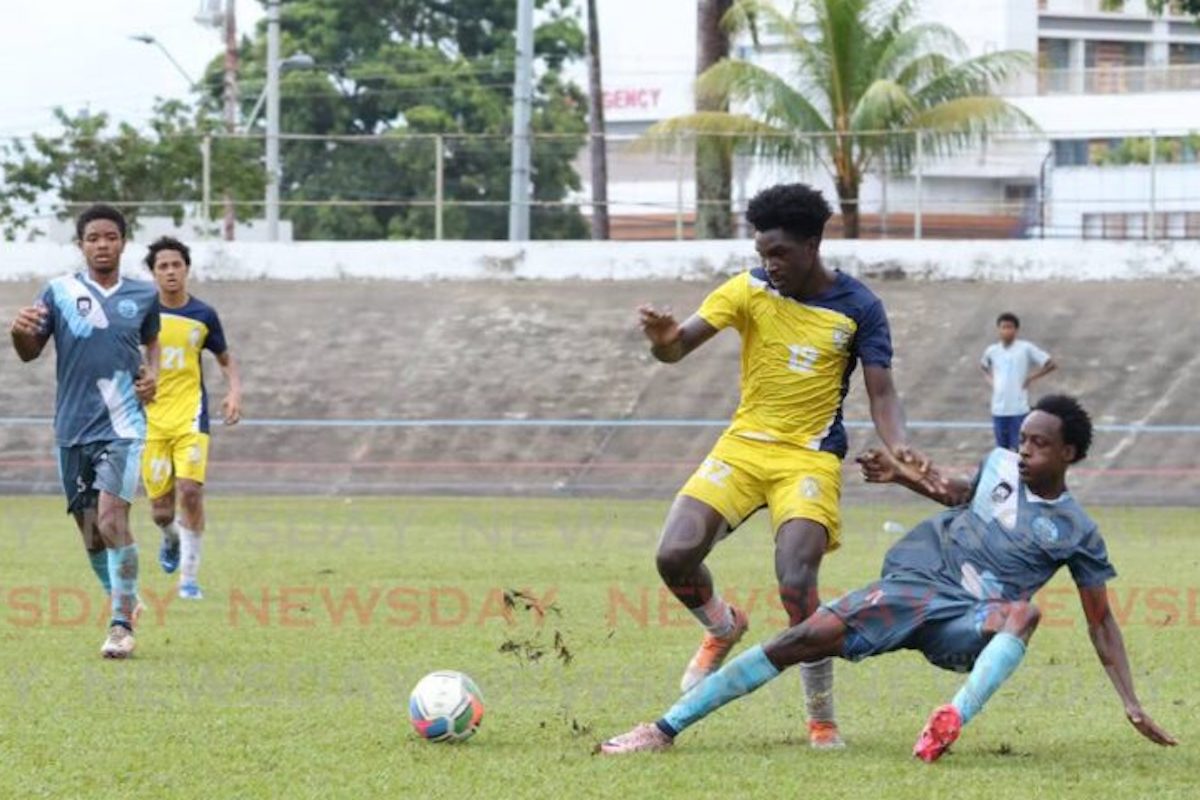 Arima North player Nkosi Fuentes, right, tackles Trinity College East footballer Anderson Barnwell during the East zone Intercol semifinal at Arima Velodrome on Wednesday, November 13th 2024. PHOTO BY Faith Ayoung