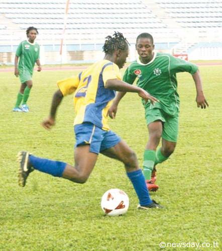 DROWNED: Form 4 Carapichaima East Secondary School student Isiah Rivers (right), seen in this file photo facing off with Jaleel Jeffrey (centre) of Waterloo Secondary School in the recent secondary school football competition, drowned yesterday at a pond in Carapichaima. ...Author: VASHTI SINGH