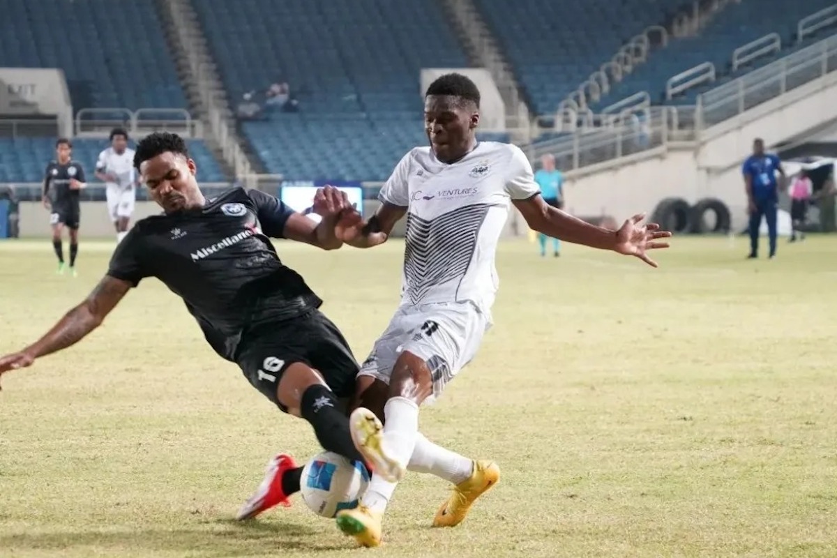 Police FC's Alvin Jones (left) tackles a Cavalier FC player during a Concacaf Caribbean Cup Group A match at Sabina Park, Kingston, Jamaica on Thursday, August 29th 2024. PHOTO: Yardie Sports