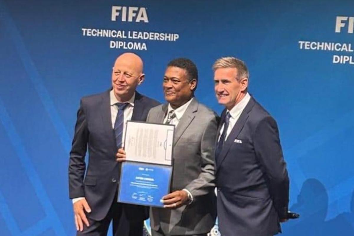 TTFA Technical Director Anton Corneal (center), FIFA Director of Global Football Development Steven Martens (left), and FIFA Head of Technical Leadership Jamie Houchen (right) pose for a photo at the graduation ceremony for the first cohort of graduates from the FIFA Technical Leadership Diploma program, at the FIA museum in Zurich, Switzerland on Friday, December 6th 2024.