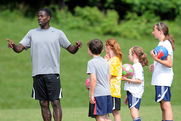 Former Rochester Rhino Craig Demmin works with players that are attending his camp in Victor.