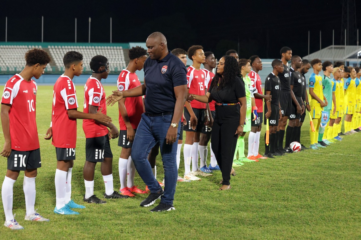 TTFA President Kieron Edwards and Minister of Sport Shamfa Cudjoe-Lewis greet the Trinidad and Tobago and Aruba teams ahead of a CFU U-14 Challenge Series match at the Dwight Yorke Stadium, Bacolet, Tobago on Saturday, August 17th 2024.