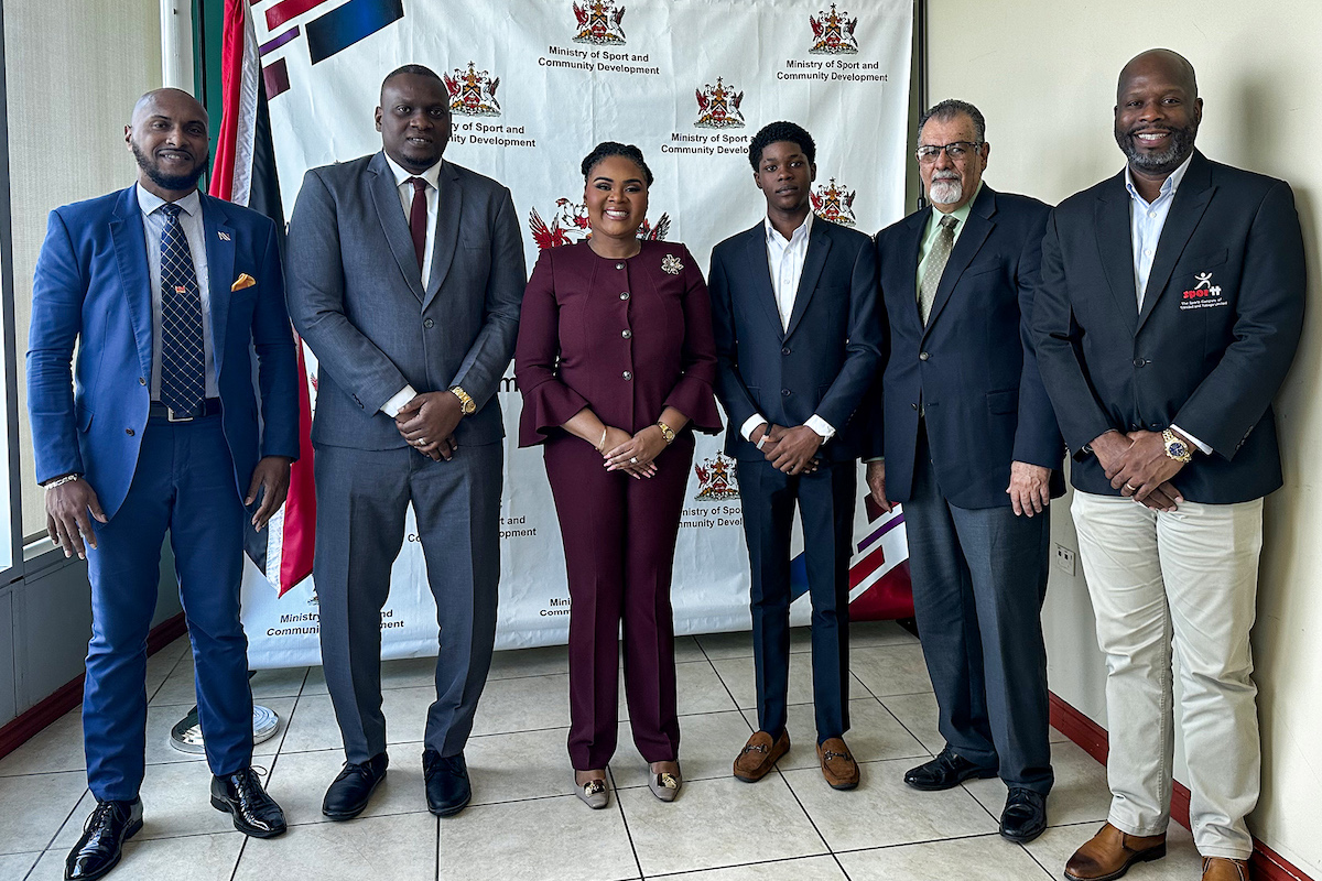 L-R: Rixon Powder, Kieron Edwards (TTFA President), Shamfa Cudjoe-Lewis (Minister of Sport), (unknown), Michael Romany, Justin Latapy-George