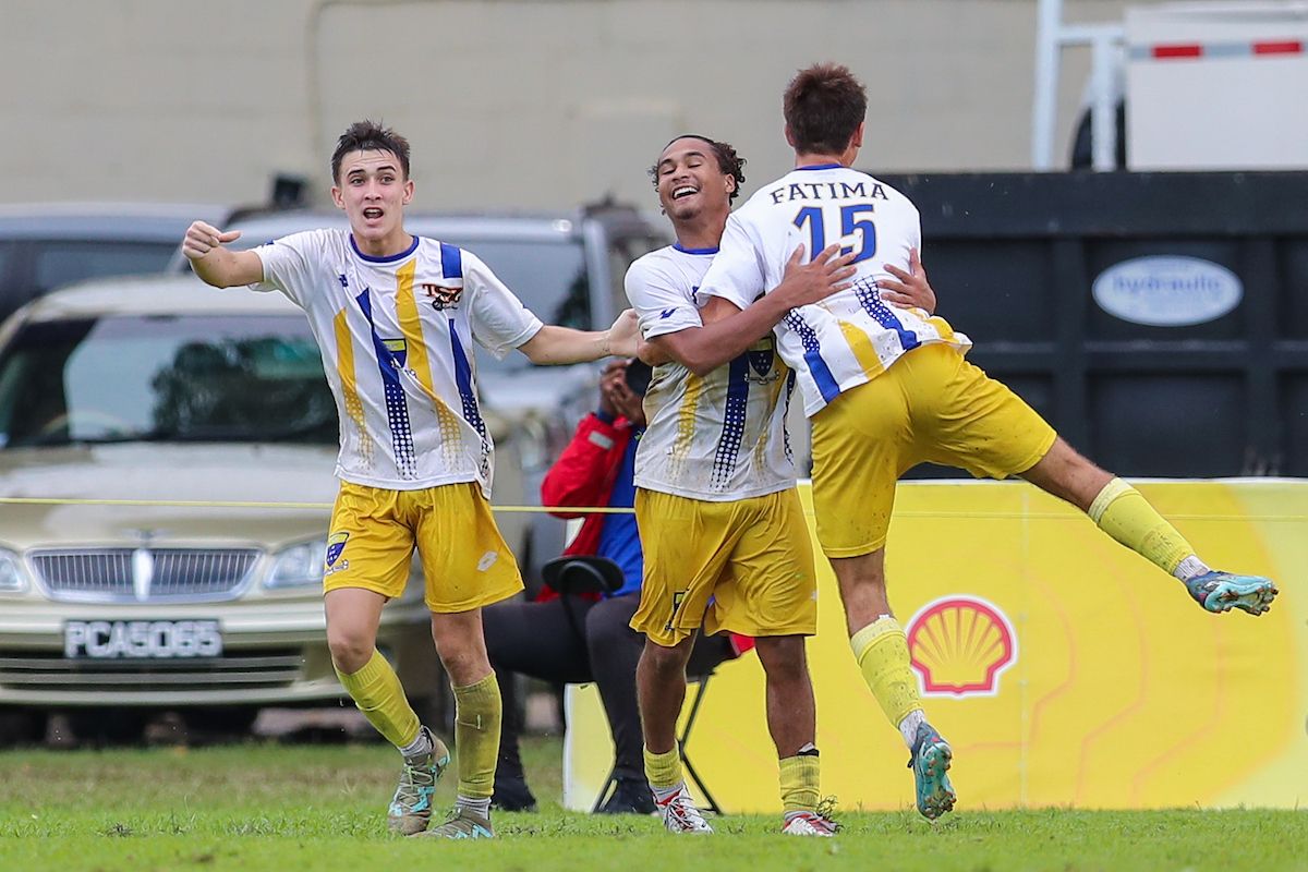 Fatima College’s Luke Correia, centre, celebrates with teammates after scoring the equalising goal against Naparima College during a SSFL Premiership Division match at the Fatima College ground, Mucurapo, Port-of-Spain, Wednesday 18th, 2024. PHOTO BY Daniel Prentice