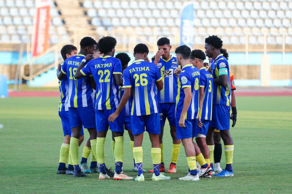 Fatima College players huddle during the 2024 Secondary Schools Football League National Coca-Cola Intercol title against St Benedict's College at the Ato Boldon Stadium in Balmain, Couva on Thursday, December 5th 2024. 