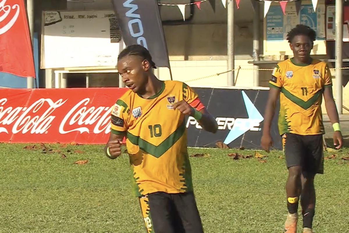 St. Benedict's captain Derrel Garcia (left) celebrates after scoring the opening goal against East Mucurapo Secondary at Fatima Grounds on Saturday, October 12th 2024.