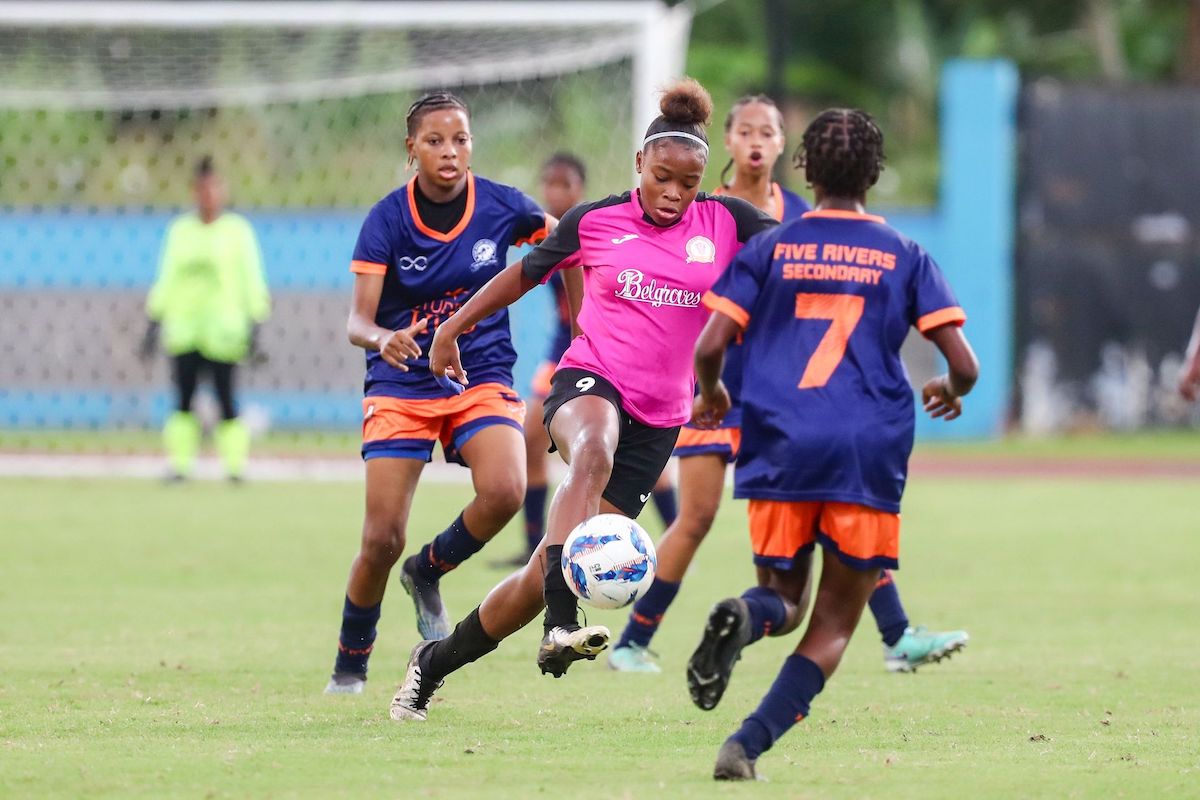 Pleasantville Secondary School’s Nikita Gosine, centre, starts an attack against Five Rivers Secondary during the SSFL Girls Big 5 final at the Ato Boldon Stadium in Balmain, Couva on Tuesday, November 26th 2024. PHOTO BY Daniel Prentice