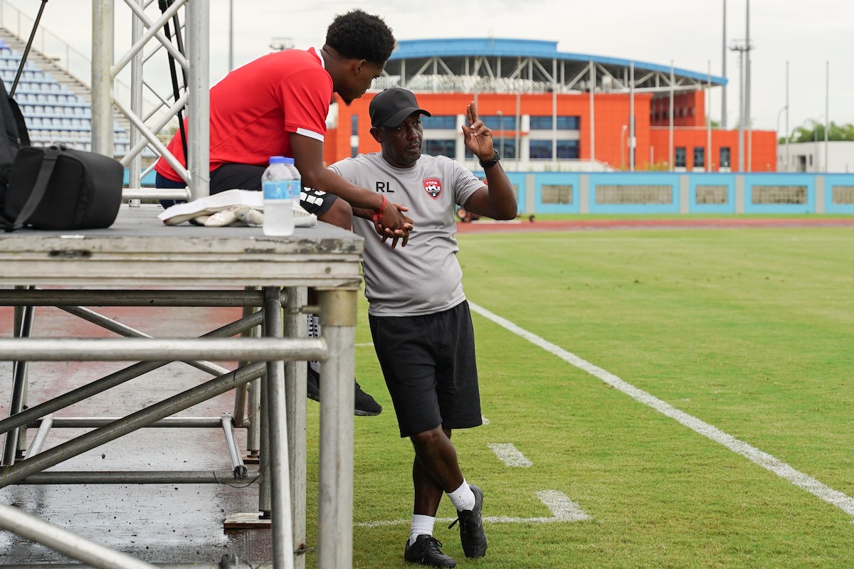 Trinidad and Tobago Assistant Coach Russell Latapy (right) speaks with Joevin Jones (left) at a training session at the Ato Bolton Stadium, Couva on Tuesday, November 12th 2024.