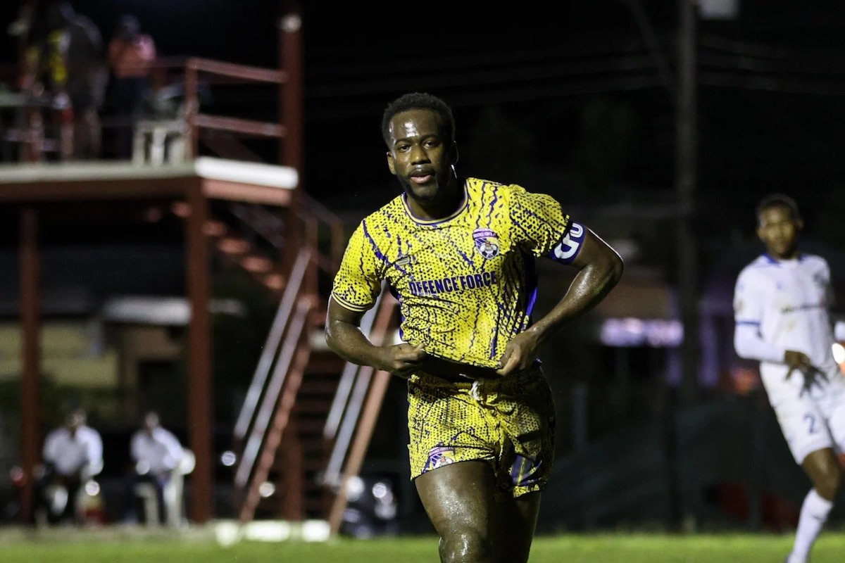 Defence Force's Kevin Molino celebrates after scoring the opening goal in a 2-1 win over Police FC at La Horquetta Recreation Ground on Friday, December 6th 2024.