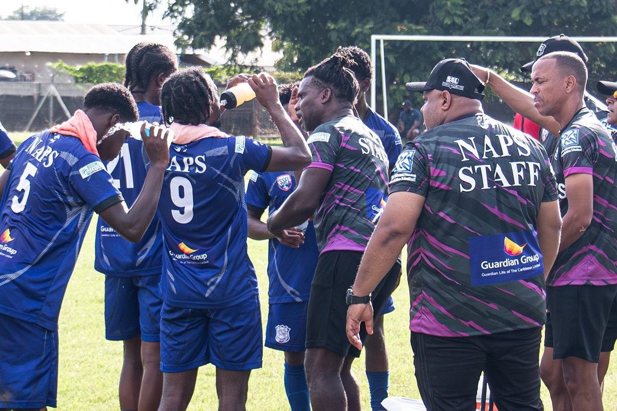 Naparima College players and technical staff gather for a refreshment break during a match against Signal Hill Secondary at Signal Hill Grounds, Tobago on Wednesday, October 23rd 2024.