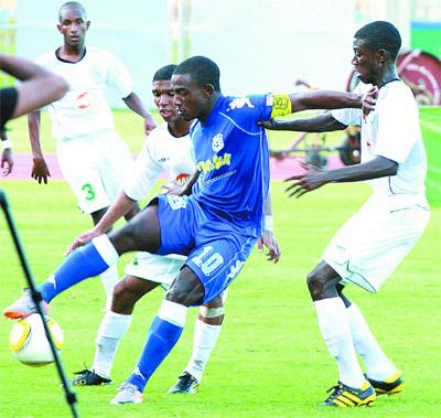 Anthony Parris of Naparima, centre, holds off two St Augustine players during their 2010 BG T&T Secondary Schools Football League (SSFL) Big Five semifinal at the Manny Ramjohn Stadium, Marabella, yesterday. Gustine won the match 3-1 to advance to the final against the winner of today’s semifinal between St Anthony’s and Signal Hill at the Hasely Crawford Stadium, Mucurapo. Photo: Rishi Ragoonath