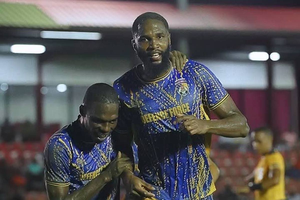 Defence Force central defender Jelani Peters (R) is congratulated by Shaquille Bertrand after scoring the winning goal in their team's TT Premier Football League clash with San Juan Jabloteh at the Phase 2 La Horquetta Recreation Ground on Friday, December 13th 2024.