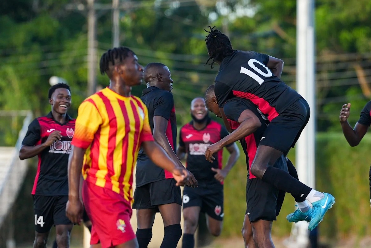 1976 FC Phoenix's Jariel Arthur (#10) jumps on the back of Lashawn Roberts in celebration of the latter's goal against Point Fortin Civic FC at the Mahaica Sporting Complex, Point Fortin on Sunday, December 8th 2024.