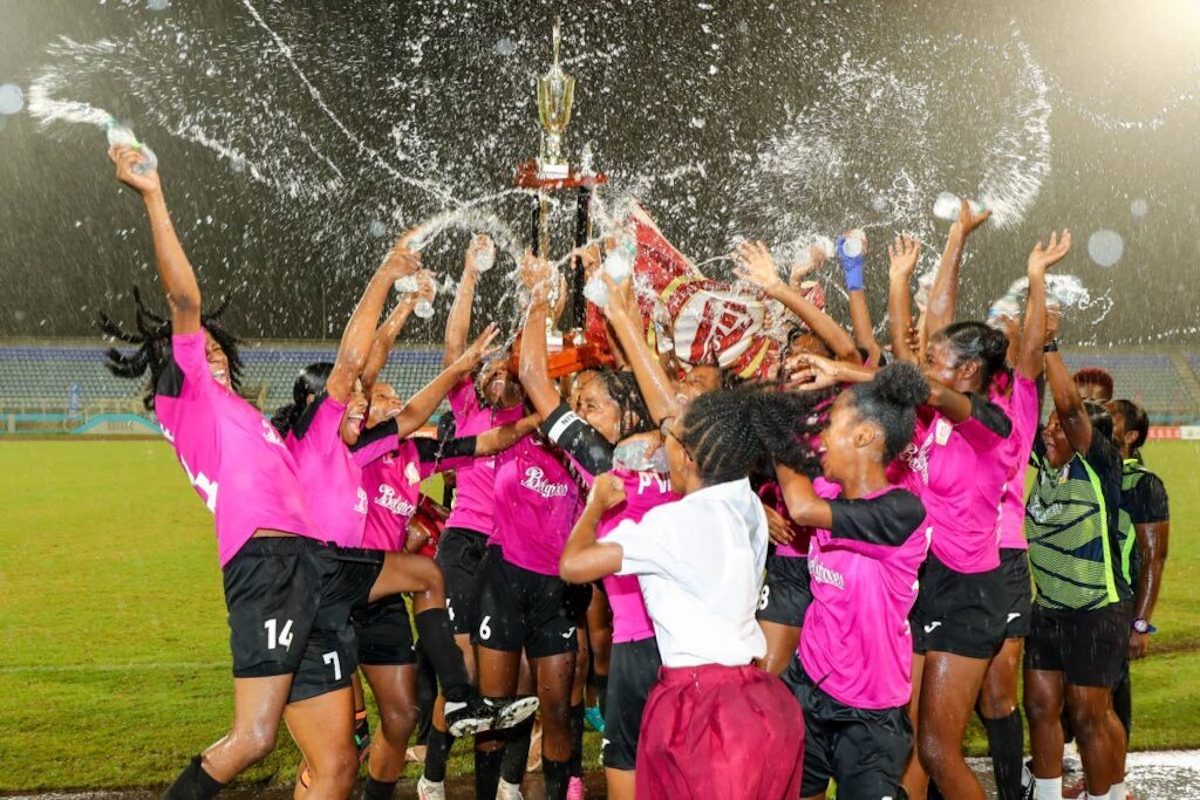 BIG CHAMPS: A joyous Pleasantville Secondary girls football team celebrates after beating Five Rivers Secondary 3-0 in the Secondary Schools Girls' Big Five final, on Tuesday, November 26th 2024, at the Ato Boldon Stadium, Balmain, Couva. PHOTO BY Daniel Prentice