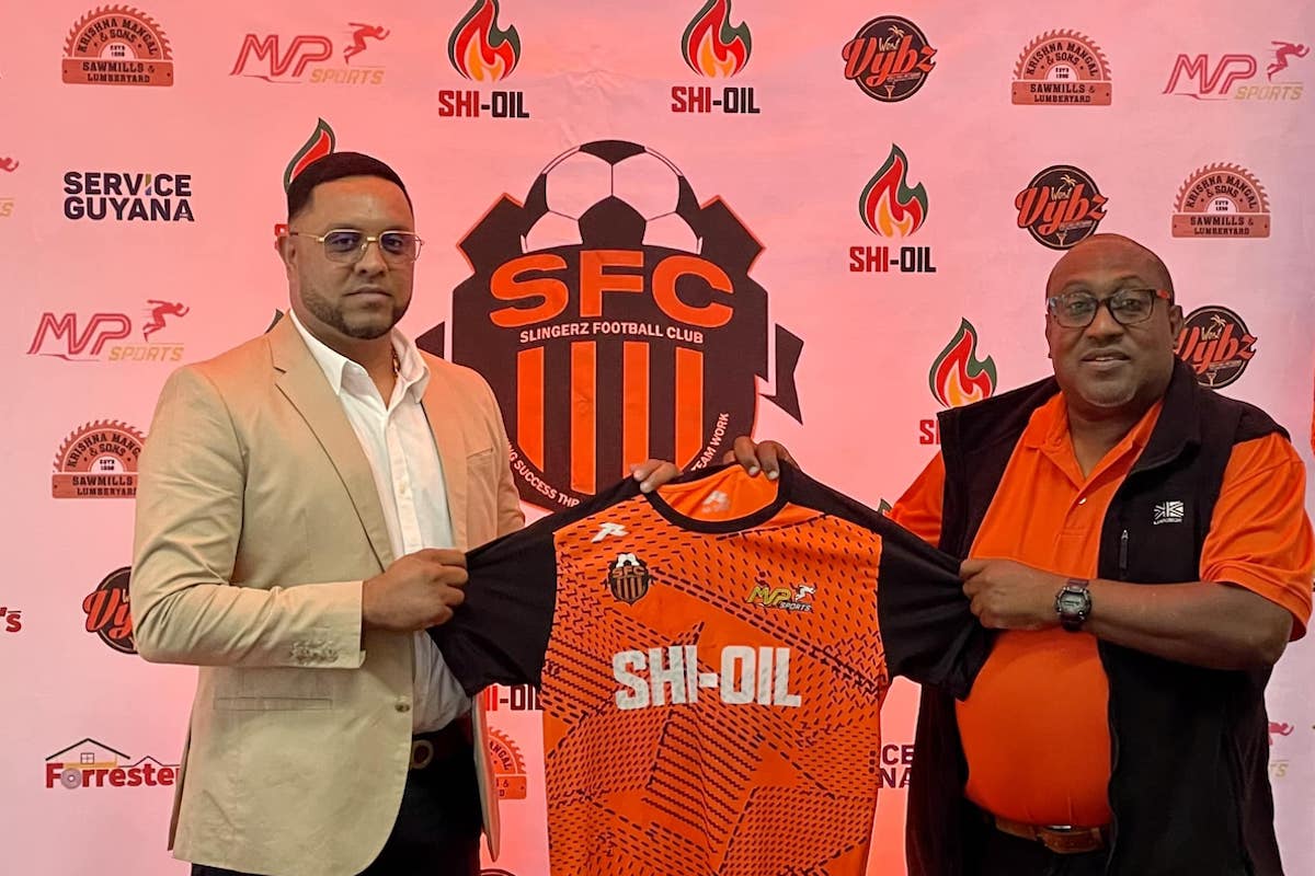 Coach Jamaal Shabazz (right) being welcomed to Slingerz FC by the club’s president, Javed Ali