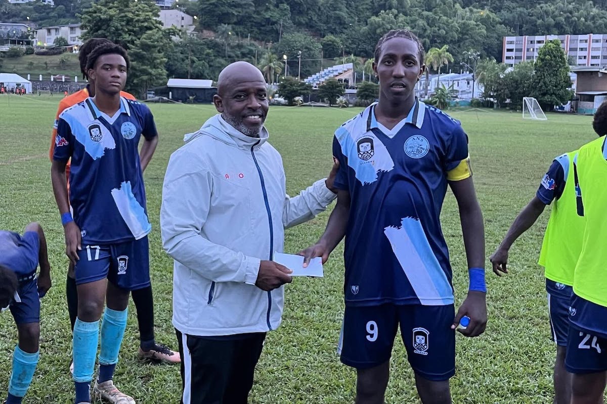 Arima North Secondary Head Coach Wayne Sheppard with goalscorer Tyrell Stapleton (#9) after defeating St. Anthony's College 3-1 at the latter's ground in Westmoorings on Wednesday, September 18th 2024.