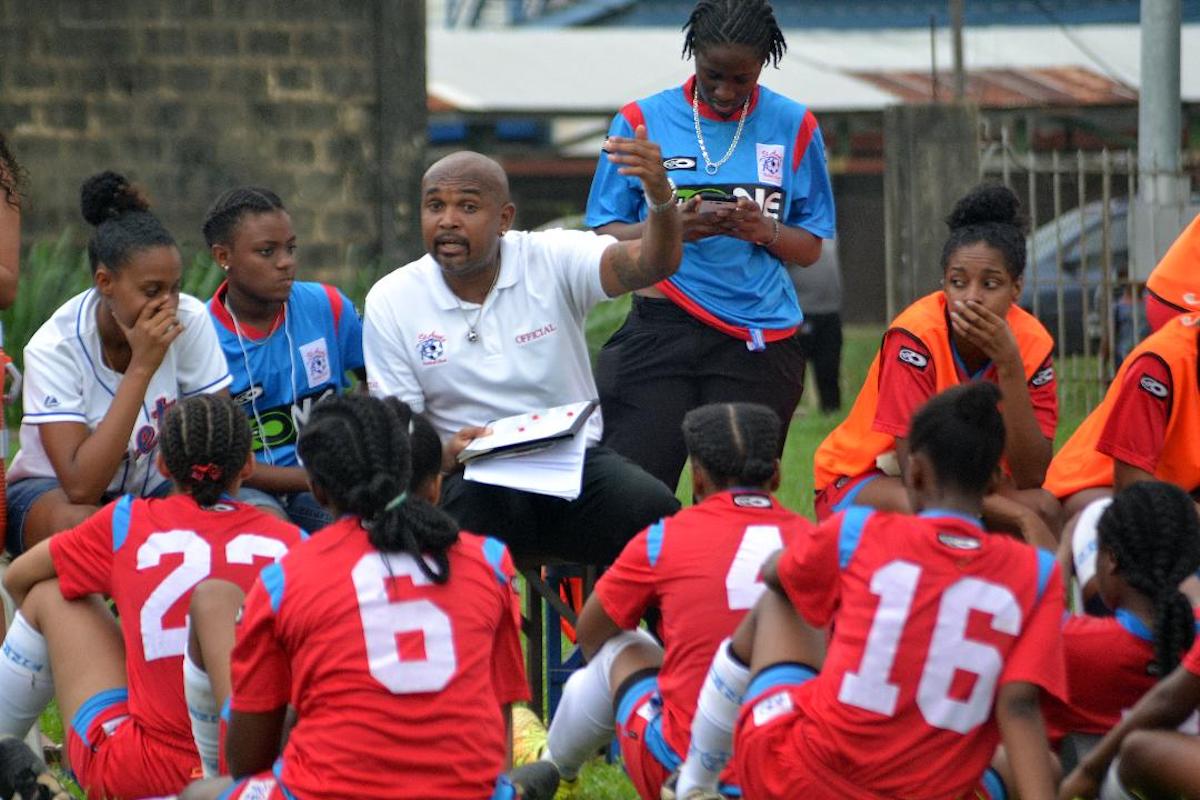 Jason Spence addresses some local players during a past training session.