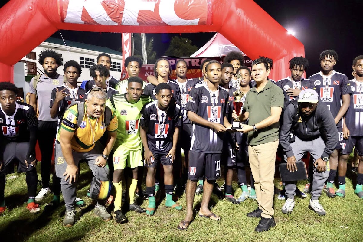 St. Benedict's College players pose with their runners-up medals after falling 8-7 on penalty kicks to Chase Academy in the KFC Goodwill International Schools Football Tournament final match at the Ministry of Education Ground, Georgetown, Guyana on Sunday, December 22nd 2024.