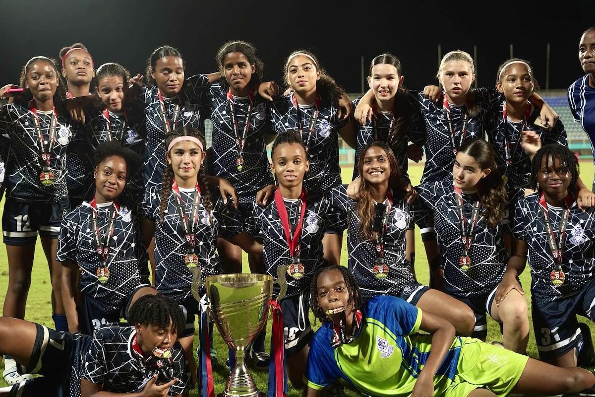 St Joseph's Convent Port of Spain players display their trophy and medals after beating Pleasantville Secondary 5-3 via penalties, during the Secondary Schools Football League Coca-Cola girls' intercol final, on Thursday, December 5th 2024, at the Ato Boldon Stadium, Couva. PHOTO BY TotalSportt