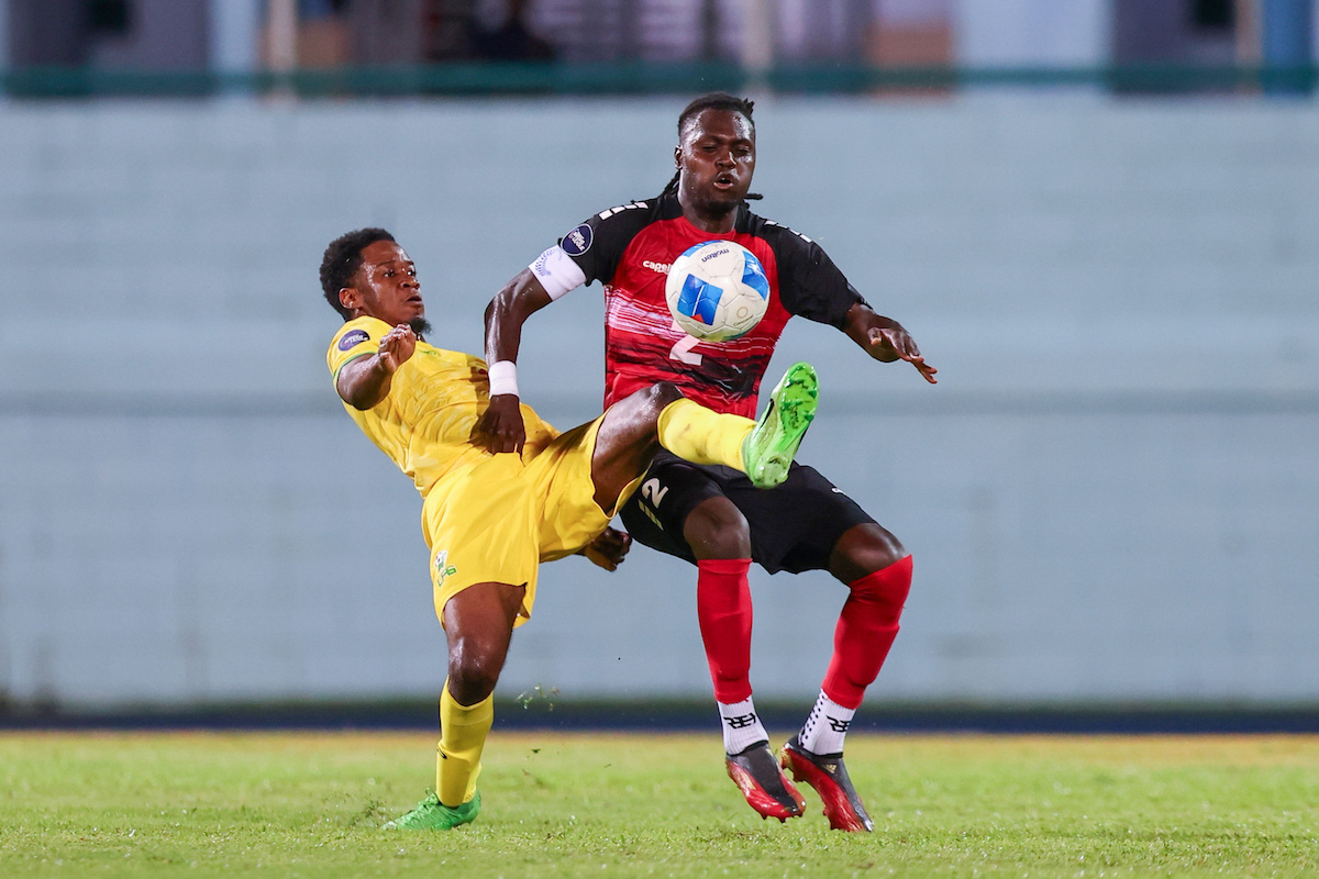 Trinidad and Tobago Captain Aubrey David (right) battles a French Guianese player for the ball during a Concacaf Nations League match at Dwight Yorke Stadium, Bacolet, Tobago on Tuesday, September 10th 2024.