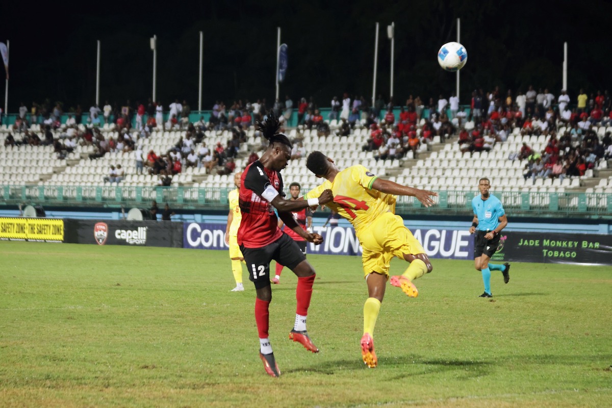 Trinidad and Tobago Captain Aubrey David (left) heads the ball during a Concacaf Nations League match against French Guiana at Dwight Yorke Stadium, Bacolet, Tobago on Tuesday, September 10th 2024.