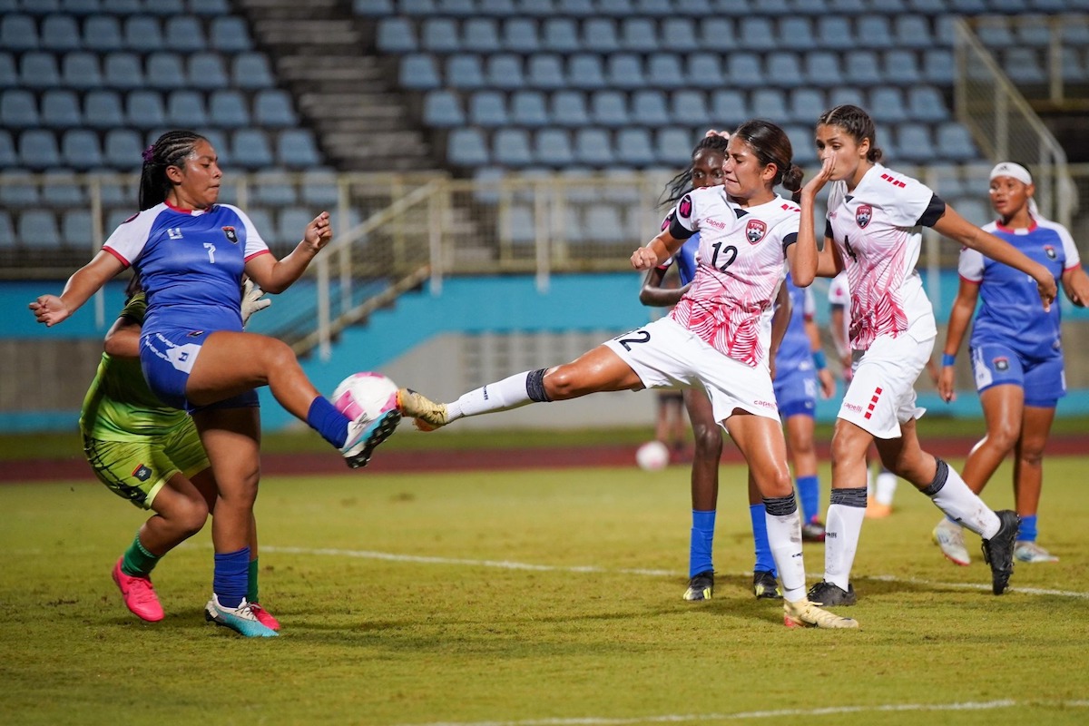 Trinidad and Tobago'sRori Gittens (#12) challenges Belize's Riann Acal (#7) for the ball during a Concacaf Women's U-17 qualifying match at the Ato Boldon Stadium, Couva on Wednesday, January 29th 2025.