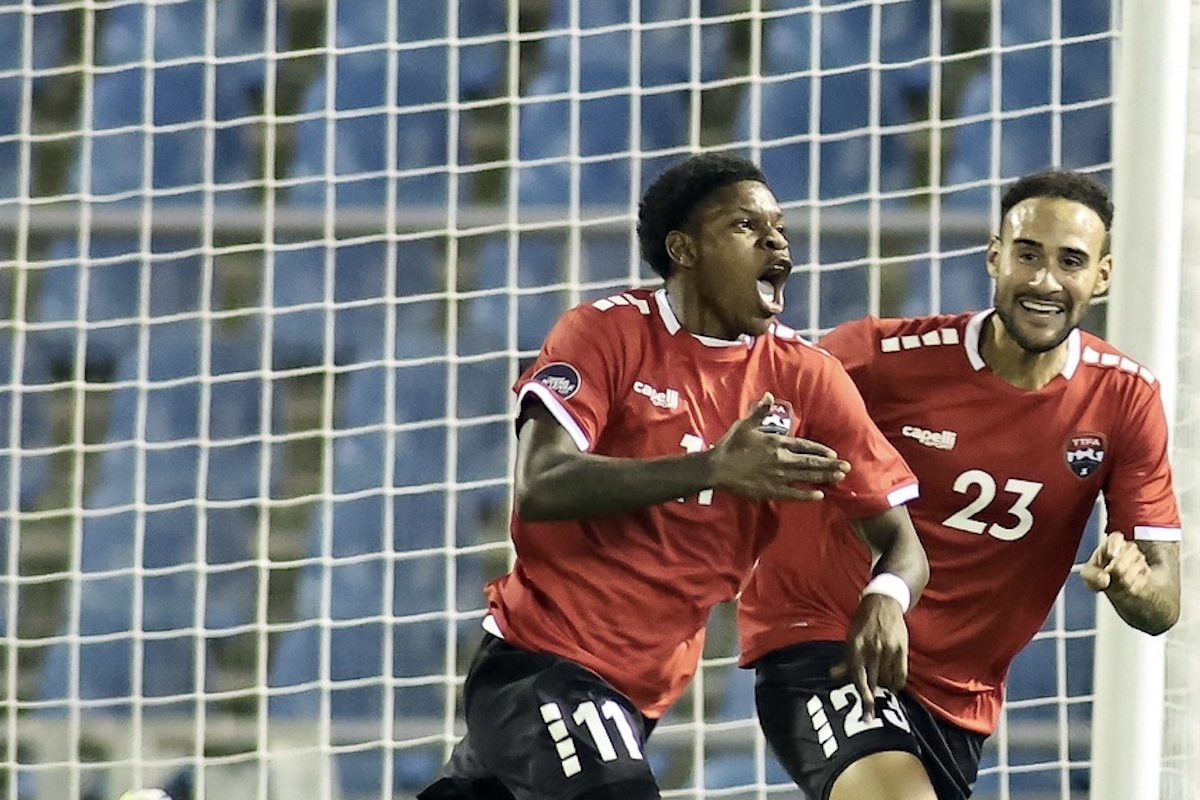 Trinidad and Tobago's Nathaniel James (#11) celebrates after scoring the winning goal against Curaçao in a Concacaf Nations League match at the Hasely Crawford Stadium on Thursday, September 7th 2023. Alongside him is midfielder Kristian Lee-Him (#23).