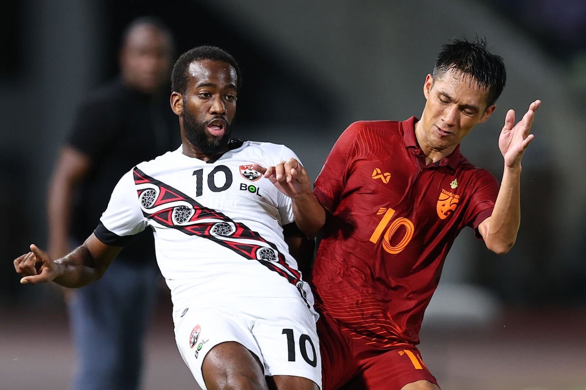 Kevin Molino of Trinidad and Tobago (L) controls the ball under pressure of Jakkaphan Kaewprom of Thailand (R) during the international friendly match between Thailand and Trinidad and Tobago at 700th Anniversary Stadium on September 25, 2022 in Chiang Mai, Thailand. (Photo by Pakawich Damrongkiattisak/Getty Images)