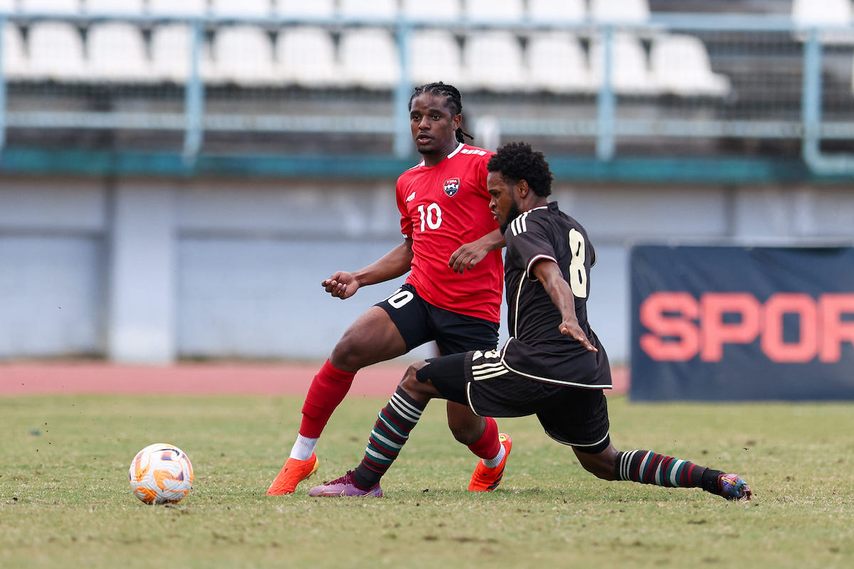 Trinidad and Tobago's Duane Muckette (left) is challenged for the ball by Jamaica's Alex Marshall (right) during an International Friendly at Larry Gomes Stadium, Malabar on March 3rd 2024.