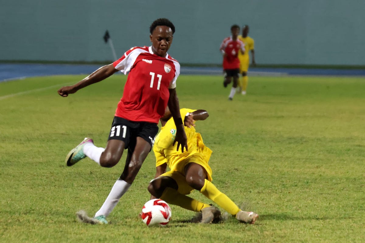 Trinidad and Tobago forward Adasa Richardson (#11) skips past a French Guiana defender during CFU Boys U-14 Series semifinal action at the Dwight Yorke Stadium, Bacolet, Tobago on Friday, August 23rd 2024.