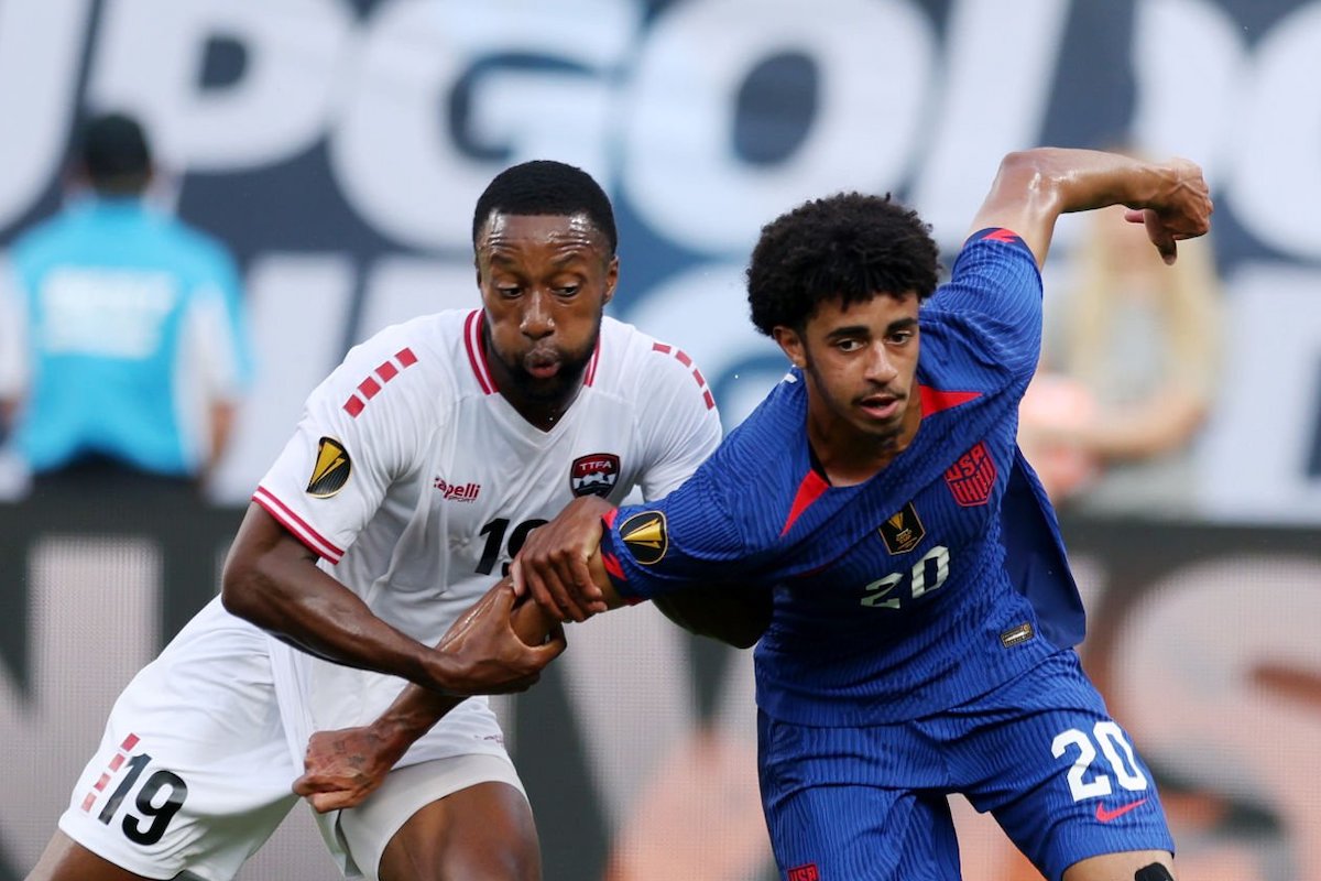 Jalen Neal #20 of the United States battles for the ball with Malcolm Shaw #19 of Trinidad and Tobago during the first halfa Group A - 2023 Concacaf Gold Cup match at Bank of America Stadium on July 02, 2023 in Charlotte, North Carolina. (Photo by John Dorton/USSF/Getty Images for USSF)