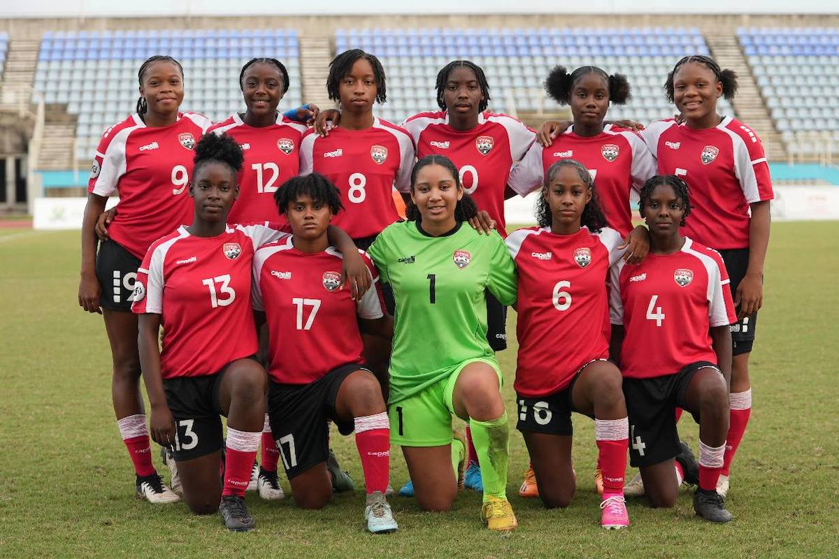 Trinidad and Tobago Women's U-17 starting eleven pose for a team photo ahead of a Jewels of the Caribbean final match against Jamaica Women's U-17 on December 20th 2024 at the Ato Boldon Stadium in Balmain, Couva. PHOTO BY Daniel Prentice 