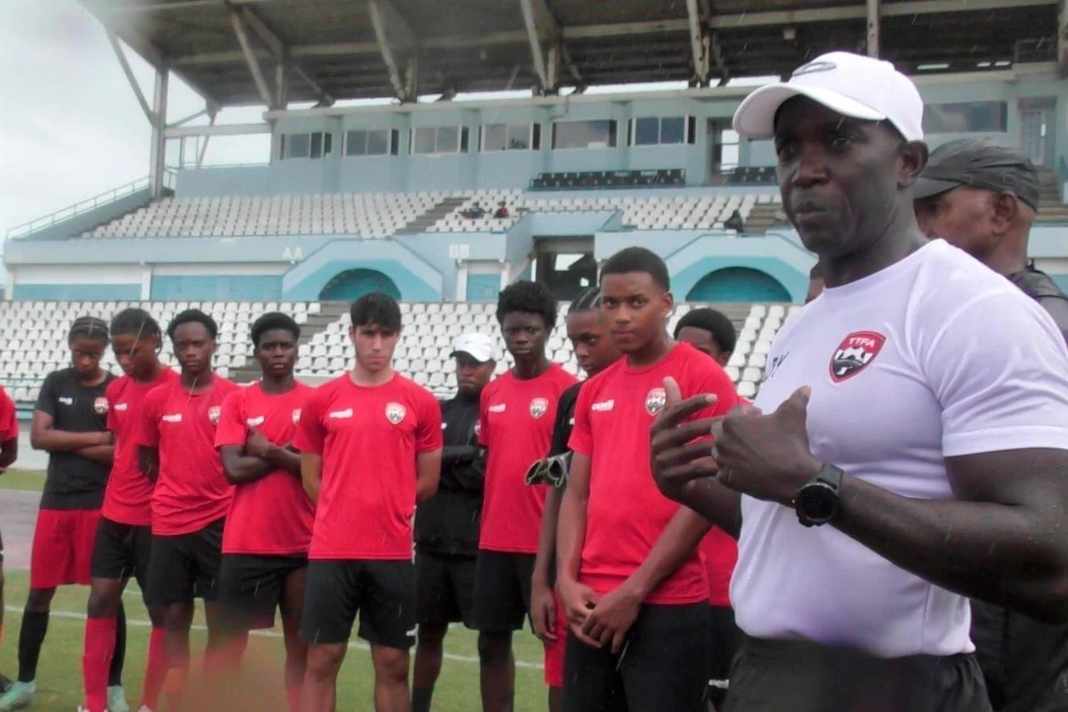 SHARING WITH THE BOYS: National senior men’c coach Dwight Yorke speaks with members of the national Under-17 training squad at the Larry Gomes Stadium, Arima on Friday, November 15th 2024.