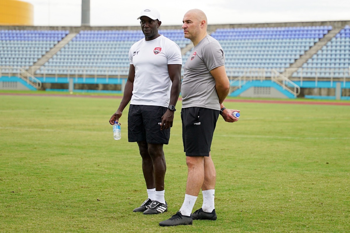 Trinidad and Tobago Head Coach Dwight Yorke (left), and Assistant Coach Neil Wood (right) observe a training session at the Ato Bolton Stadium, Couva on Tuesday, November 12th 2024.